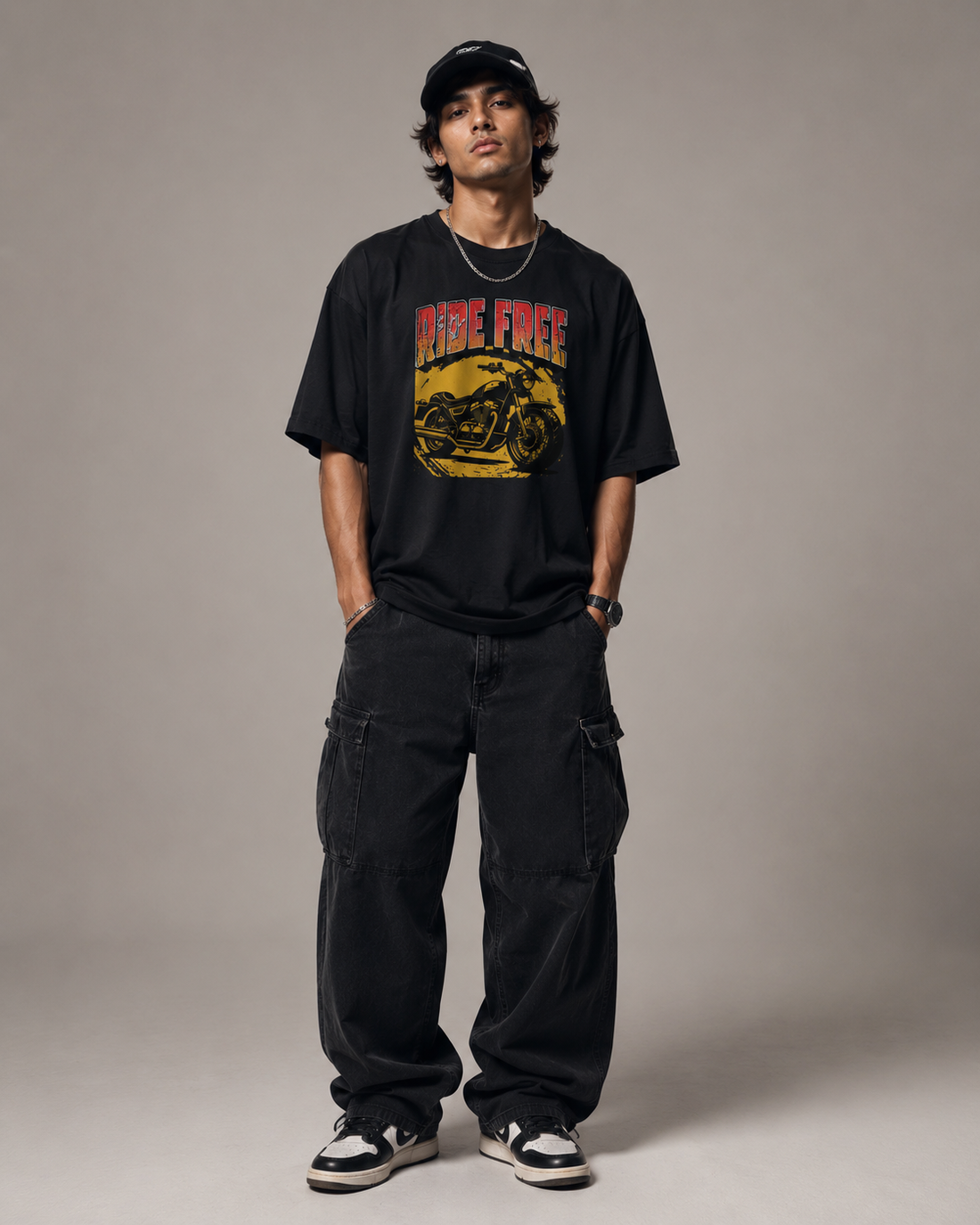 man posing to show how to style the oversized tshirt