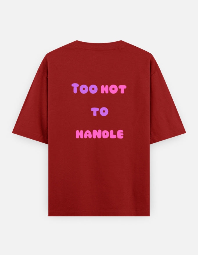 Red oversized unisex t shirt featuring a back print with the phrase TOO HOT TO HANDLE in bold retro bubble typography with a pink and purple gradient. Made from premium 240 GSM 100% cotton with a relaxed oversized fit. Available in Black and Cream by Shisha.