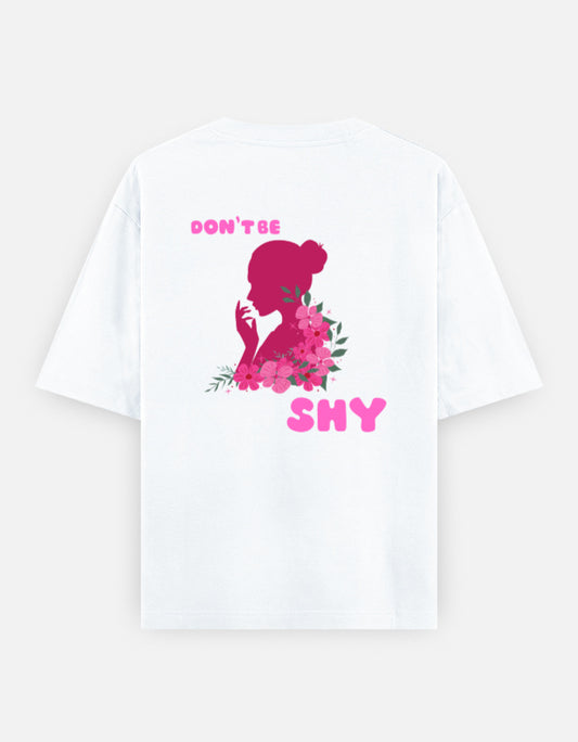oversized unisex t shirt featuring a back print of a pink floral silhouette of a woman surrounded by blooming flowers with the words DON'T BE SHY. 
