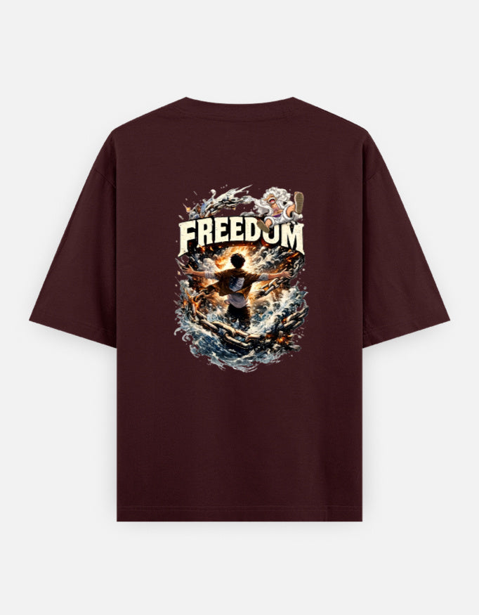 A maroon short-sleeve t-shirt shown from the back, featuring a large graphic print which have luffy and eren from anime one pieace and attack on titan with the word 'FREEDOM' and a dramatic fiery illustration.