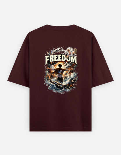 A maroon short-sleeve t-shirt shown from the back, featuring a large graphic print which have luffy and eren from anime one pieace and attack on titan with the word 'FREEDOM' and a dramatic fiery illustration.