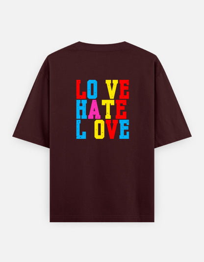 Maroon oversized unisex t shirt featuring a back print with stacked LOVE HATE LOVE typography in bold red, blue, yellow, and pink block lettering. Made from premium 240 GSM 100% cotton with a relaxed oversized fit. Available in Black and Cream by Shisha.