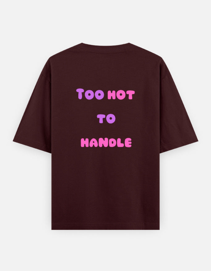 Maroon oversized unisex t shirt featuring a back print with the phrase TOO HOT TO HANDLE in bold retro bubble typography with a pink and purple gradient. Made from premium 240 GSM 100% cotton with a relaxed oversized fit. Available in Black and Cream by Shisha.