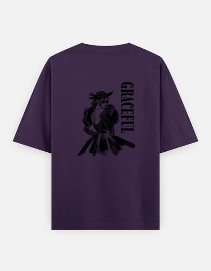 Purple oversized unisex t shirt featuring a back print of a monochrome fashion illustration of a stylish woman wearing a hat and dress alongside vertical GRACEFUL typography. Made from premium 240 GSM 100% cotton with a relaxed oversized fit. Available in Black and Cream by Shisha.