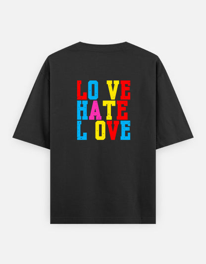 Black oversized unisex t shirt featuring a back print with stacked LOVE HATE LOVE typography in bold red, blue, yellow, and pink block lettering. Made from premium 240 GSM 100% cotton with a relaxed oversized fit. Available in Black and Cream by Shisha.