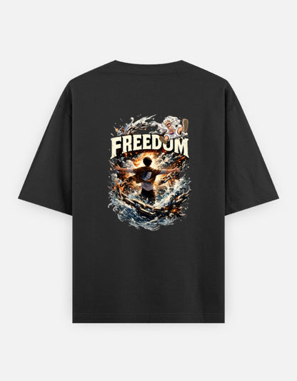 A black short-sleeve t-shirt shown from the back, featuring a large graphic print which have luffy and eren from anime one pieace and attack on titan with the word 'FREEDOM' and a dramatic fiery illustration.