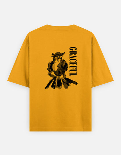 Yellow oversized unisex t shirt featuring a back print of a monochrome fashion illustration of a stylish woman wearing a hat and dress alongside vertical GRACEFUL typography. Made from premium 240 GSM 100% cotton with a relaxed oversized fit. Available in Black and Cream by Shisha.