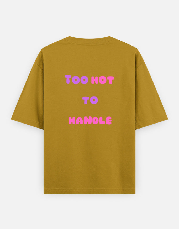 Mustord Yello oversized unisex t shirt featuring a back print with the phrase TOO HOT TO HANDLE in bold retro bubble typography with a pink and purple gradient. Made from premium 240 GSM 100% cotton with a relaxed oversized fit. Available in Black and Cream by Shisha.