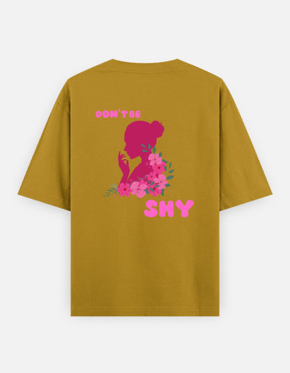 oversized unisex t shirt featuring a back print of a pink floral silhouette of a woman surrounded by blooming flowers with the words DON'T BE SHY.