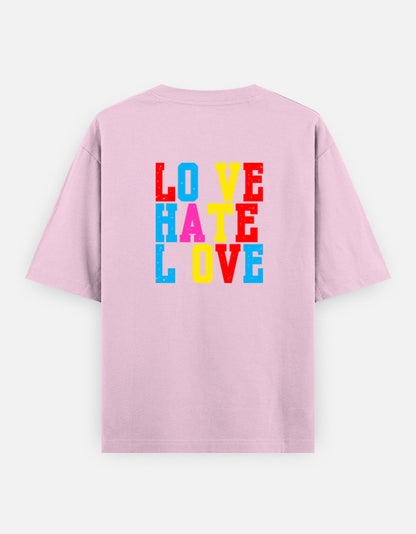 Pink oversized unisex t shirt featuring a back print with stacked LOVE HATE LOVE typography in bold red, blue, yellow, and pink block lettering. Made from premium 240 GSM 100% cotton with a relaxed oversized fit. Available in Black and Cream by Shisha.