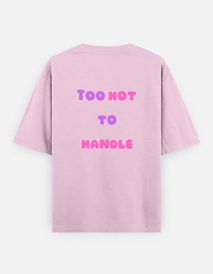 Pink oversized unisex t shirt featuring a back print with the phrase TOO HOT TO HANDLE in bold retro bubble typography with a pink and purple gradient. Made from premium 240 GSM 100% cotton with a relaxed oversized fit. Available in Black and Cream by Shisha.
