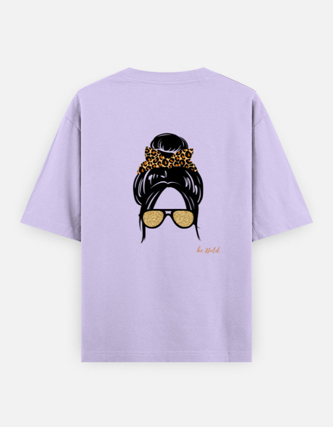 Lavender oversized unisex t shirt featuring a back print of a minimalist fashion illustration with a high messy bun tied with a leopard print scrunchie and oversized gold sunglasses. Made from premium 240 GSM cotton with a relaxed streetwear fit. Available in Black and Cream by Shisha.