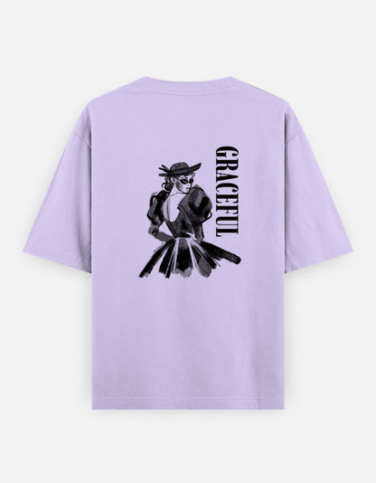 Lavender oversized unisex t shirt featuring a back print of a monochrome fashion illustration of a stylish woman wearing a hat and dress alongside vertical GRACEFUL typography. Made from premium 240 GSM 100% cotton with a relaxed oversized fit. Available in Black and Cream by Shisha.