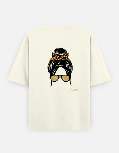 Off-white oversized unisex t shirt featuring a back print of a minimalist fashion illustration with a high messy bun tied with a leopard print scrunchie and oversized gold sunglasses. Made from premium 240 GSM cotton with a relaxed streetwear fit. Available in Black and Cream by Shisha.