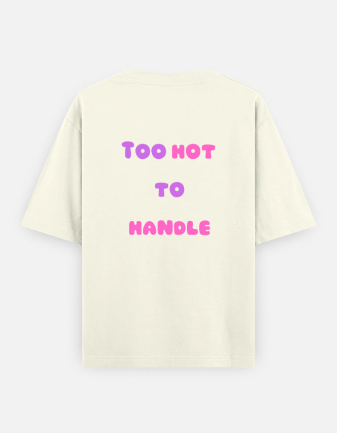 Off-White oversized unisex t shirt featuring a back print with the phrase TOO HOT TO HANDLE in bold retro bubble typography with a pink and purple gradient. Made from premium 240 GSM 100% cotton with a relaxed oversized fit. Available in Black and Cream by Shisha.