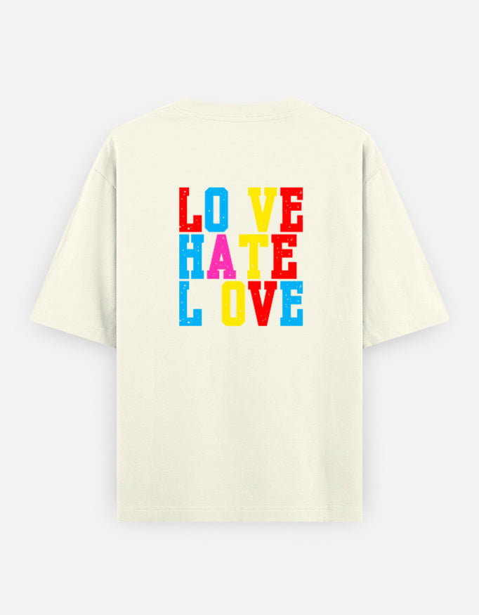 Off-white oversized unisex t shirt featuring a back print with stacked LOVE HATE LOVE typography in bold red, blue, yellow, and pink block lettering. Made from premium 240 GSM 100% cotton with a relaxed oversized fit. Available in Black and Cream by Shisha.