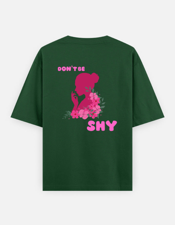 oversized unisex t shirt featuring a back print of a pink floral silhouette of a woman surrounded by blooming flowers with the words DON'T BE SHY.