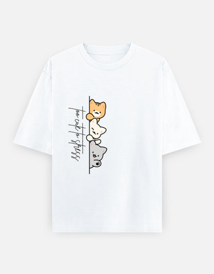 White oversized unisex t shirt featuring a cute front print of three cartoon cats peeking from behind a vertical line with the text "perfect stress." Made from premium 240 GSM cotton with a relaxed oversized streetwear fit. Available in Black and Cream by Shisha.