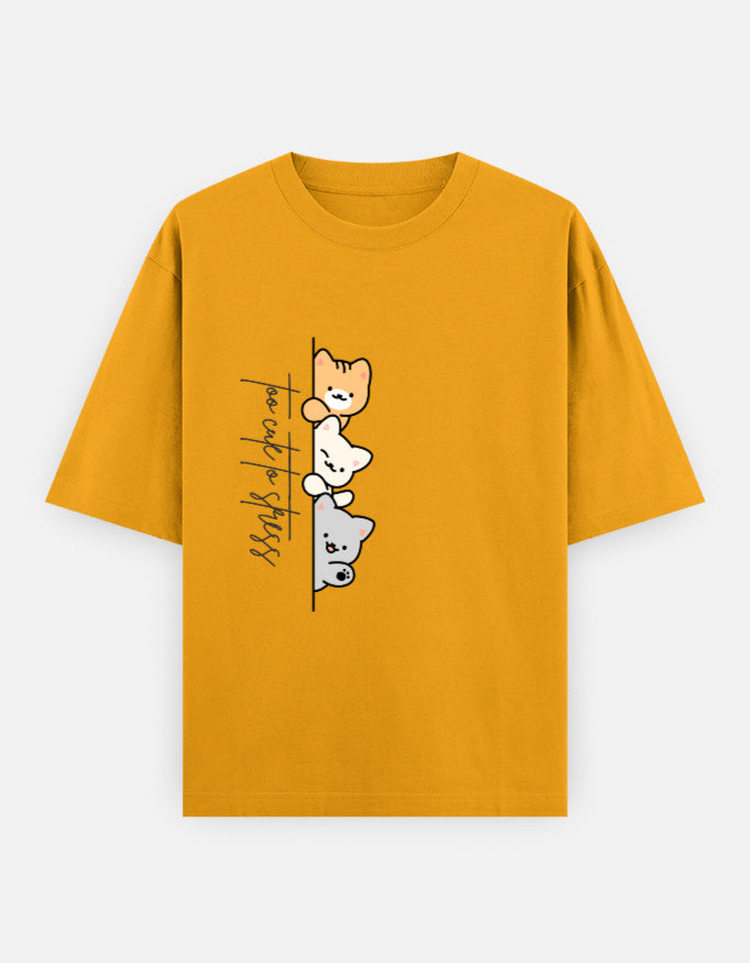 Yellow oversized unisex t shirt featuring a cute front print of three cartoon cats peeking from behind a vertical line with the text "perfect stress." Made from premium 240 GSM cotton with a relaxed oversized streetwear fit. Available in Black and Cream by Shisha.